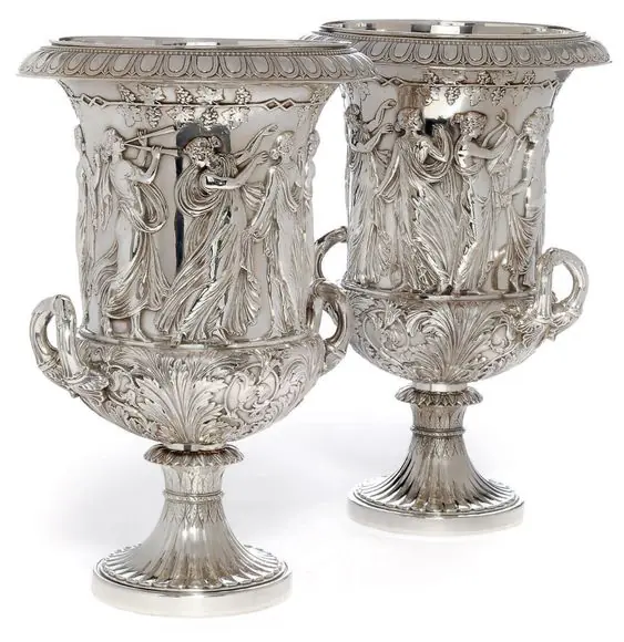 Pair of silver goblets with sculptural relief